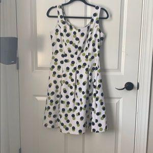 White dress with green and black polka dots